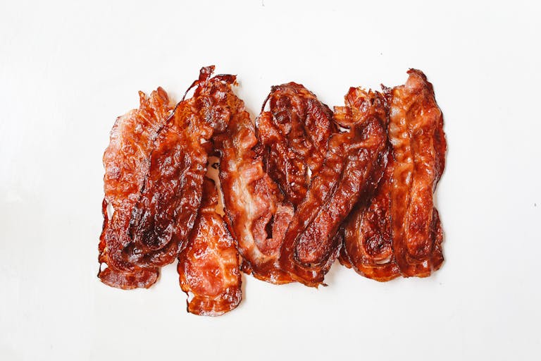 A tempting display of crispy bacon strips, perfect for breakfast or a savory treat.