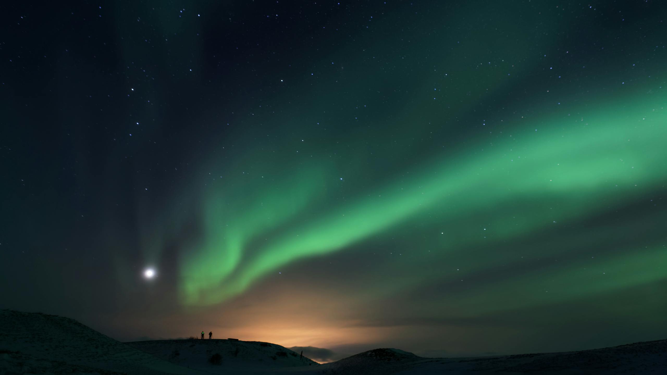 Earth’s Magnetic Shield Nearly Collapsed 41,000 Years Ago Captivating view of the Aurora Borealis dancing over a tranquil snowy landscape at night.