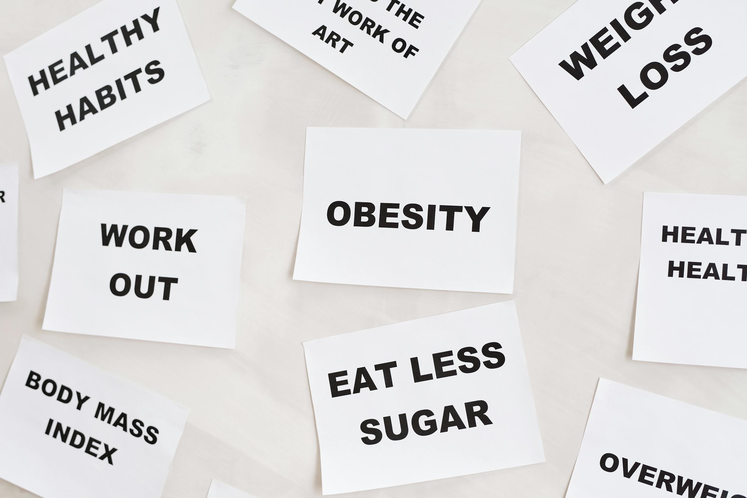 Weight-Loss Drug Tirzepatide Shows Potential to Shrink Breast Cancer Tumors in Mice Conceptual image featuring motivational cards on health, fitness, and wellness on a white background.