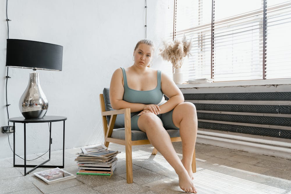 Cornell Scientists Discover a Key to Reversing Age-Related Weight Gain Confident plus size woman in a serene setting, embracing self-esteem and body positivity.