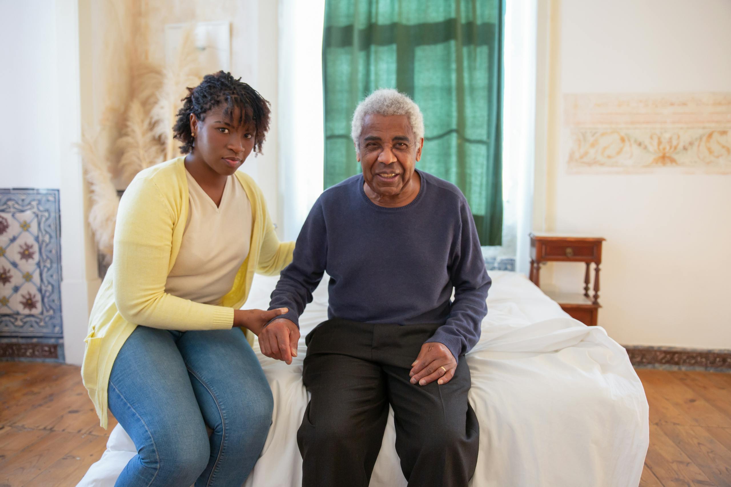 New Biomarker Shows Promise for Detecting Alzheimer’s Long Before Symptoms Daughter supporting elderly father in a bright, cozy room filled with love and warmth.