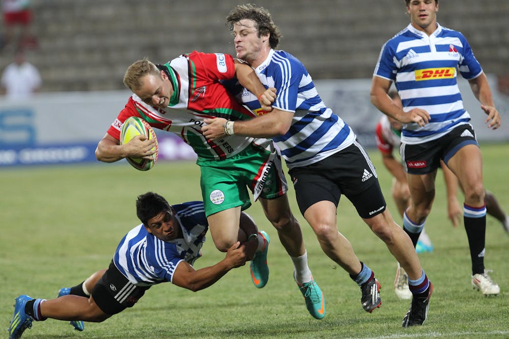 Rugby Linked to Higher Dementia Risk: New Zealand Study Reveals the Numbers Dynamic action shot of rugby players in a fierce tackle during a lively outdoor game.