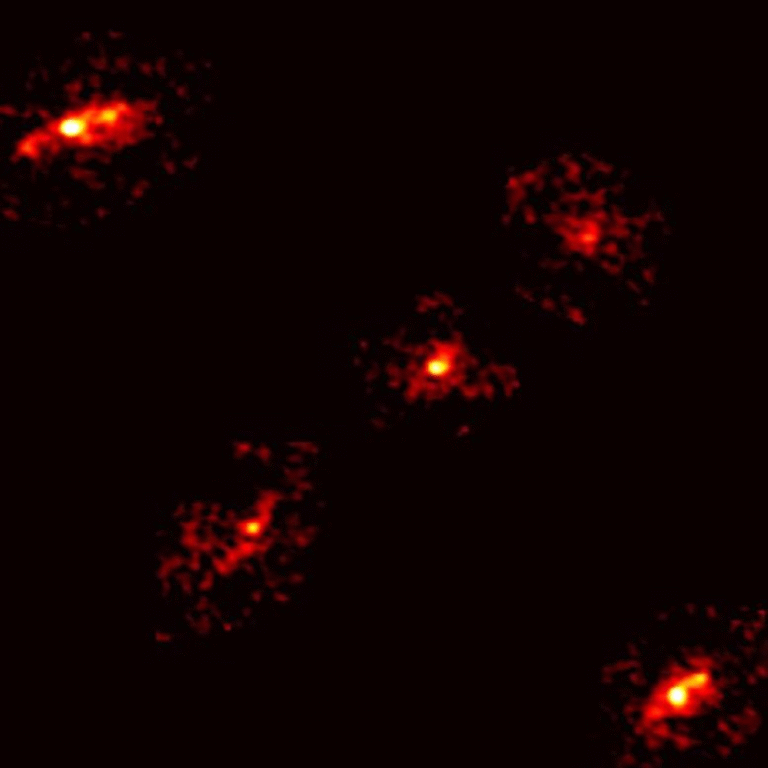 Astronomers Discover a Rare Einstein Cross with a Fifth Image Revealing Dark Matter