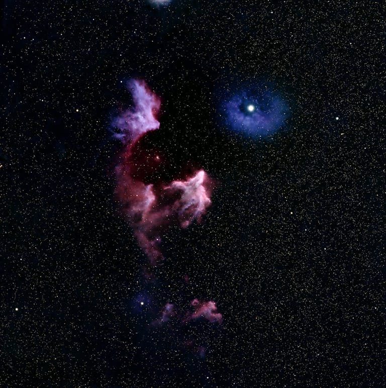 Stunning image of a colorful nebula surrounded by countless stars in the cosmos.