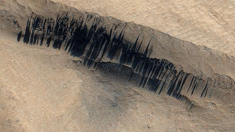 Rare Meteoroid Impact on Mars Creates Over a Hundred New Slope Streaks and Reveals How Dust Moves Across the Red Planet