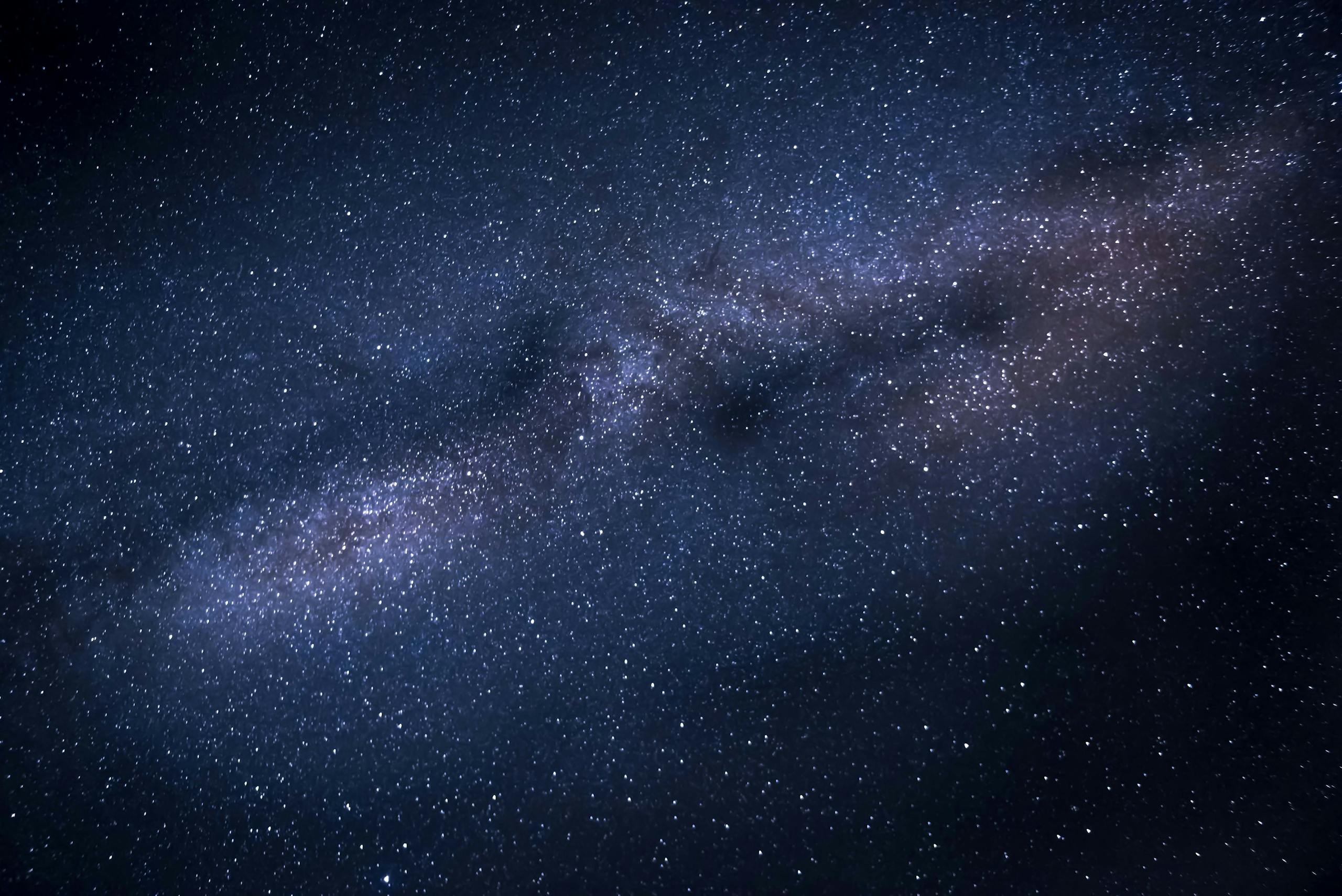 A breathtaking image capturing the Milky Way galaxy against a dark, starry night sky.