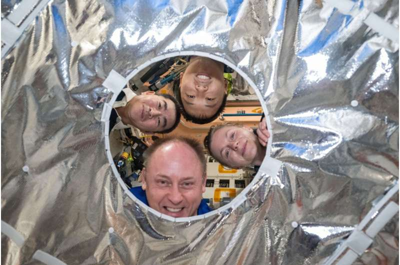 NASA Astronauts Spotlight a Crucial Hatch Thermal Cover Protecting the International Space Station