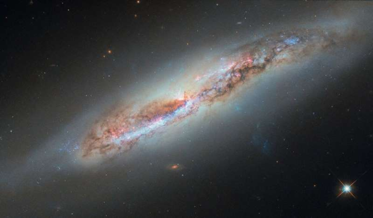 Hubble Captures Galactic Gas Escaping From the Spiral Galaxy NGC 4388