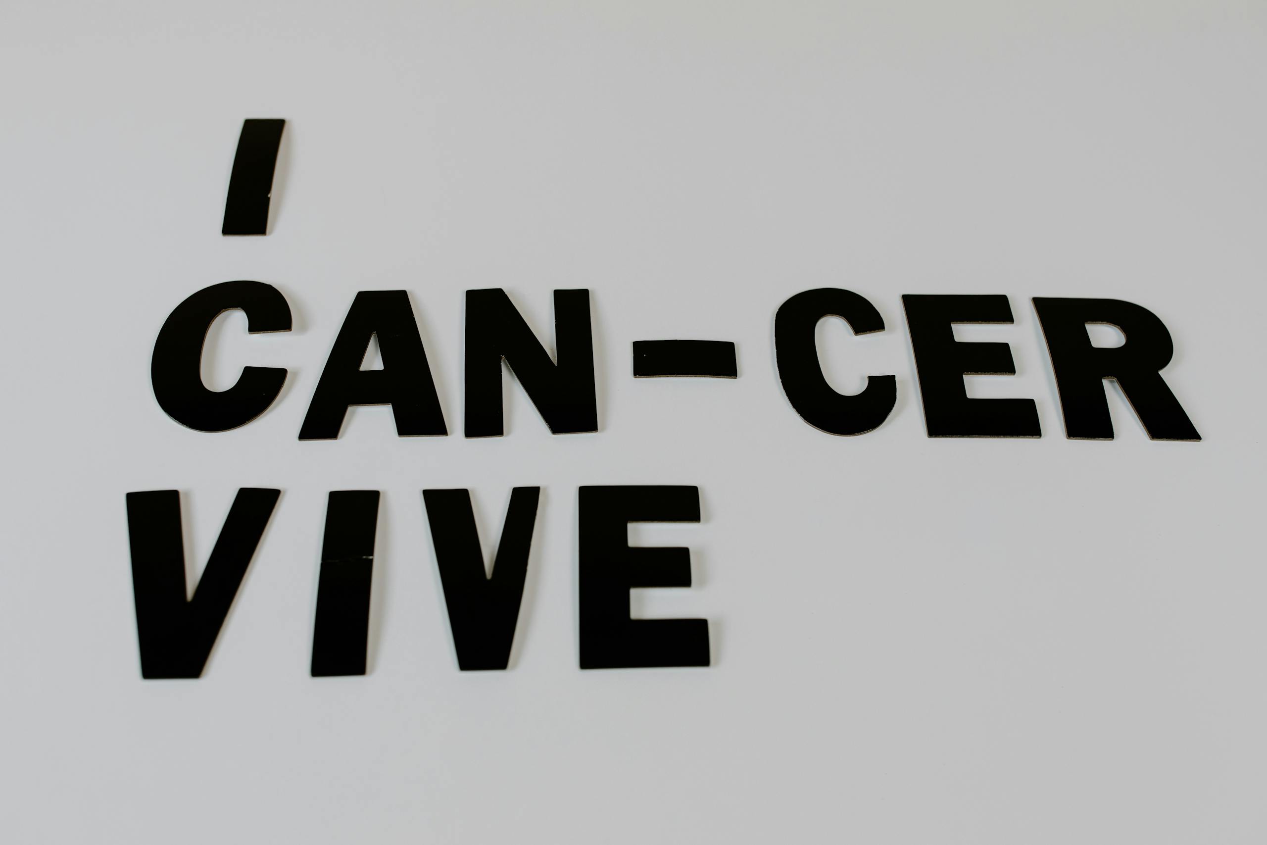 Uplifting text 'I Can-Cer Vive' promoting cancer awareness and survival.