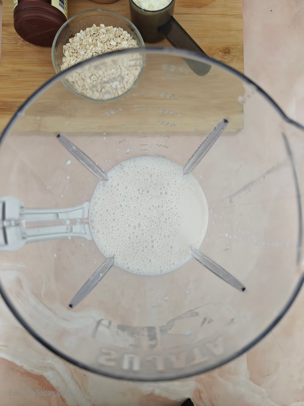 Peanut Butter Oats Smoothie Milk poured into blender jar to start making peanut butter oats smoothie